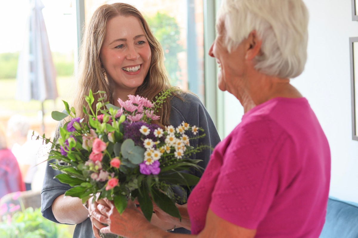 Granddaughter giving bouquet to grandmother delivered the same day